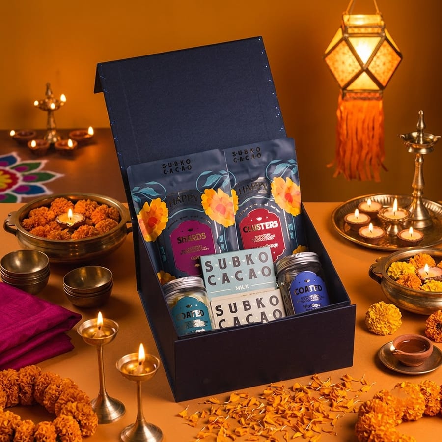 The Gulaab Taufah hamper, styled with diyas and marigolds