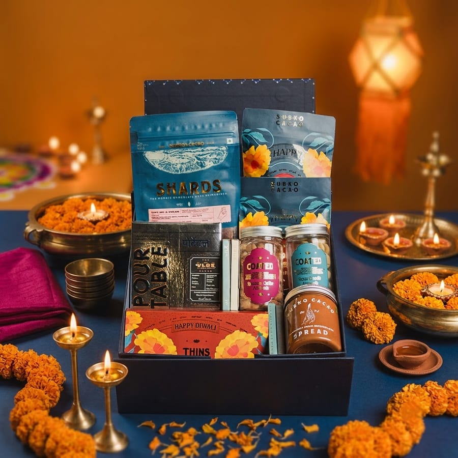 The Jashn Taufah hamper, styled with diyas and marigolds